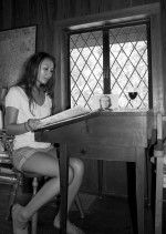 Black & White photo of visitor at desk